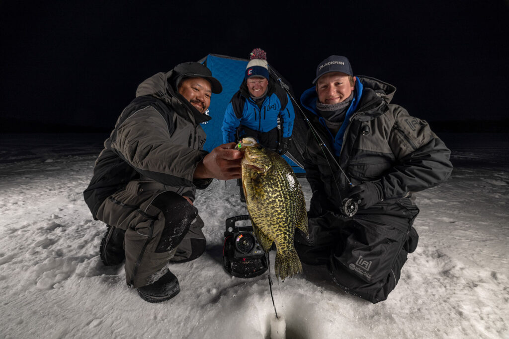 Baxter MN, brand development, marketing materials, Rawfish Media, videography, photography, social media management, ice fishing, three men fishing, ice fishing and camping, Minnesota, night ice fishing, fishing at night, blue tent